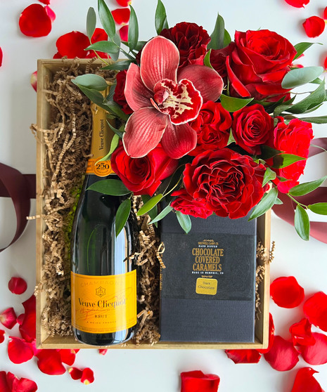 red floral arrangement with wine