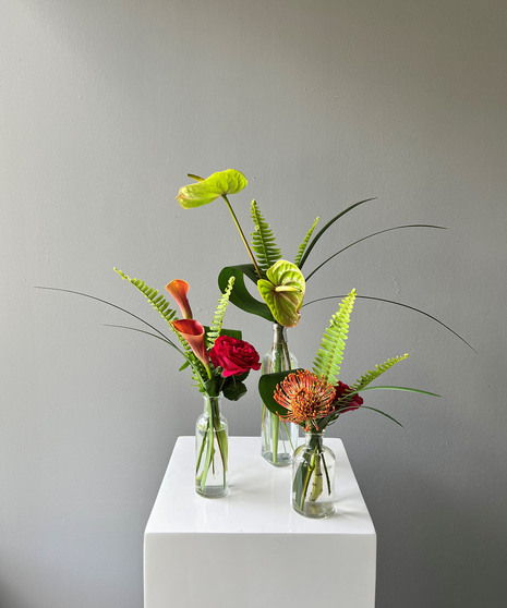 jewel toned collection of bud vases