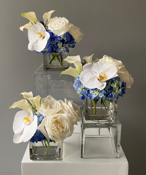 white and blue trio of floral designs