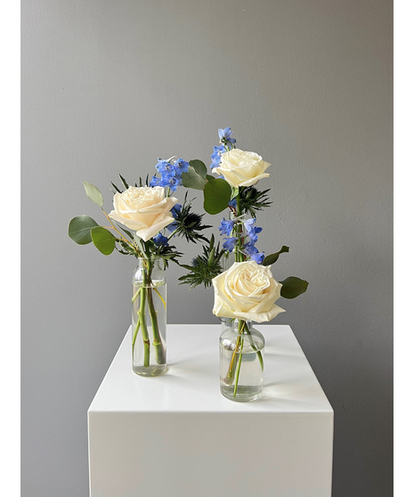 white and blue bud vase