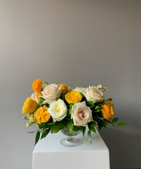 vivid yellow and cream floral arrangement