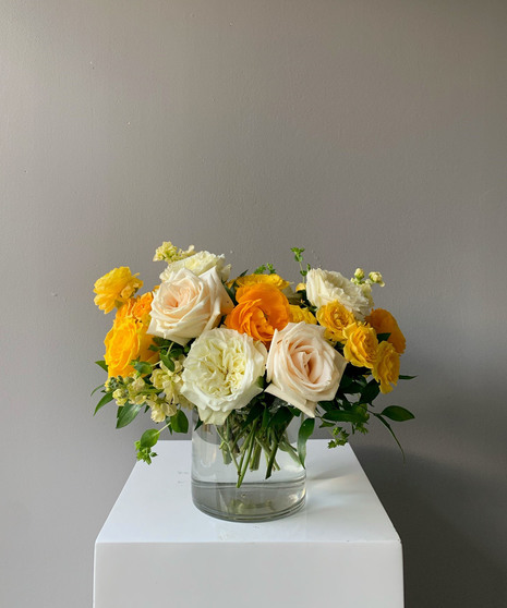 vivid yellow and cream floral arrangement